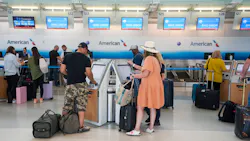 Passengers check in at the American Airlines counters at Terminal D at DFW Airport on Thursday, June 16, 2022.