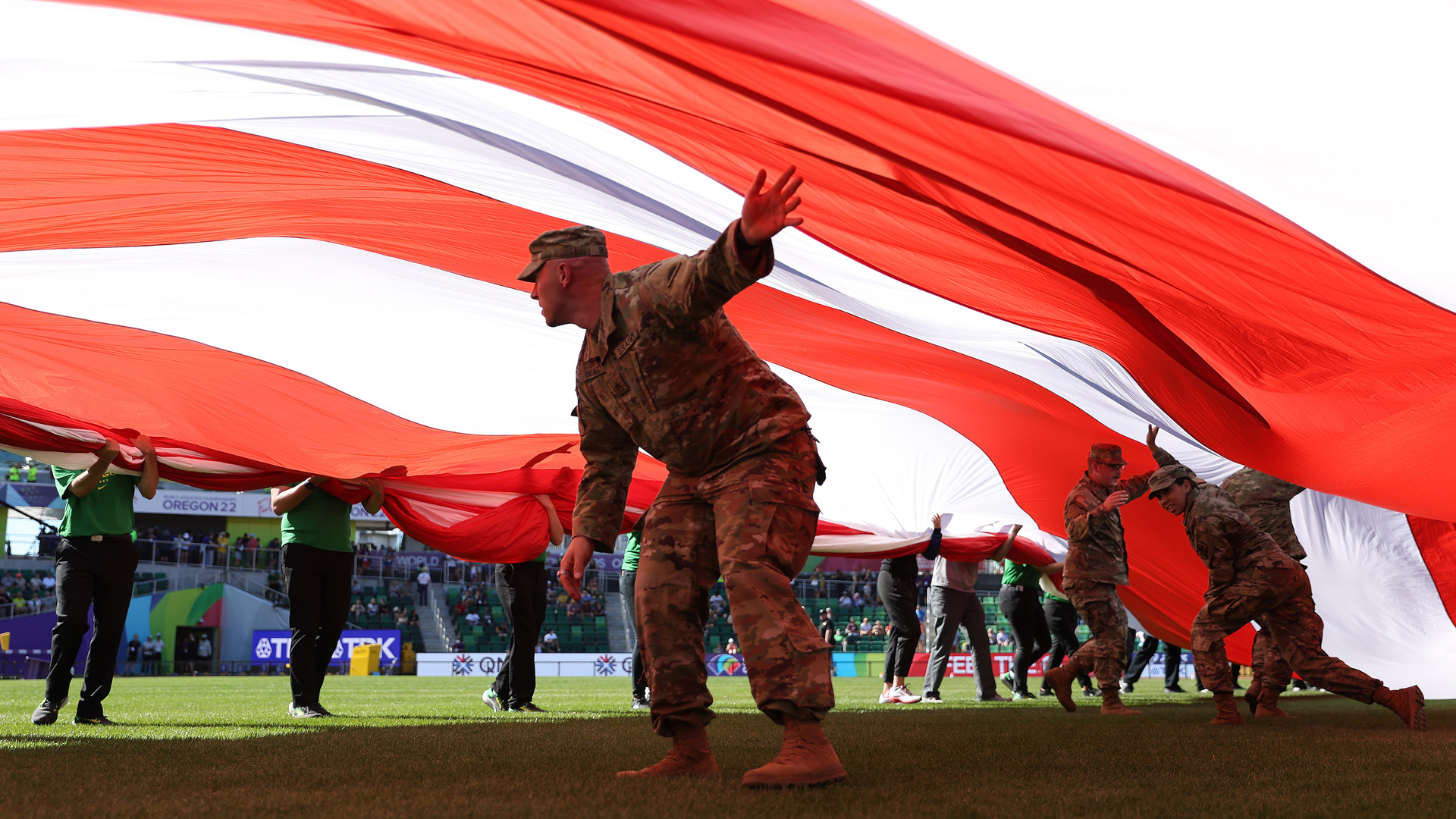 Members of the U.S. military hold an American flag during the Opening Ceremony on day one of the World Athletics Championships Oregon22 at Hayward Field on July 15, 2022, in Eugene, Oregon.