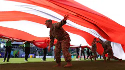 Members of the U.S. military hold an American flag during the Opening Ceremony on day one of the World Athletics Championships Oregon22 at Hayward Field on July 15, 2022, in Eugene, Oregon.