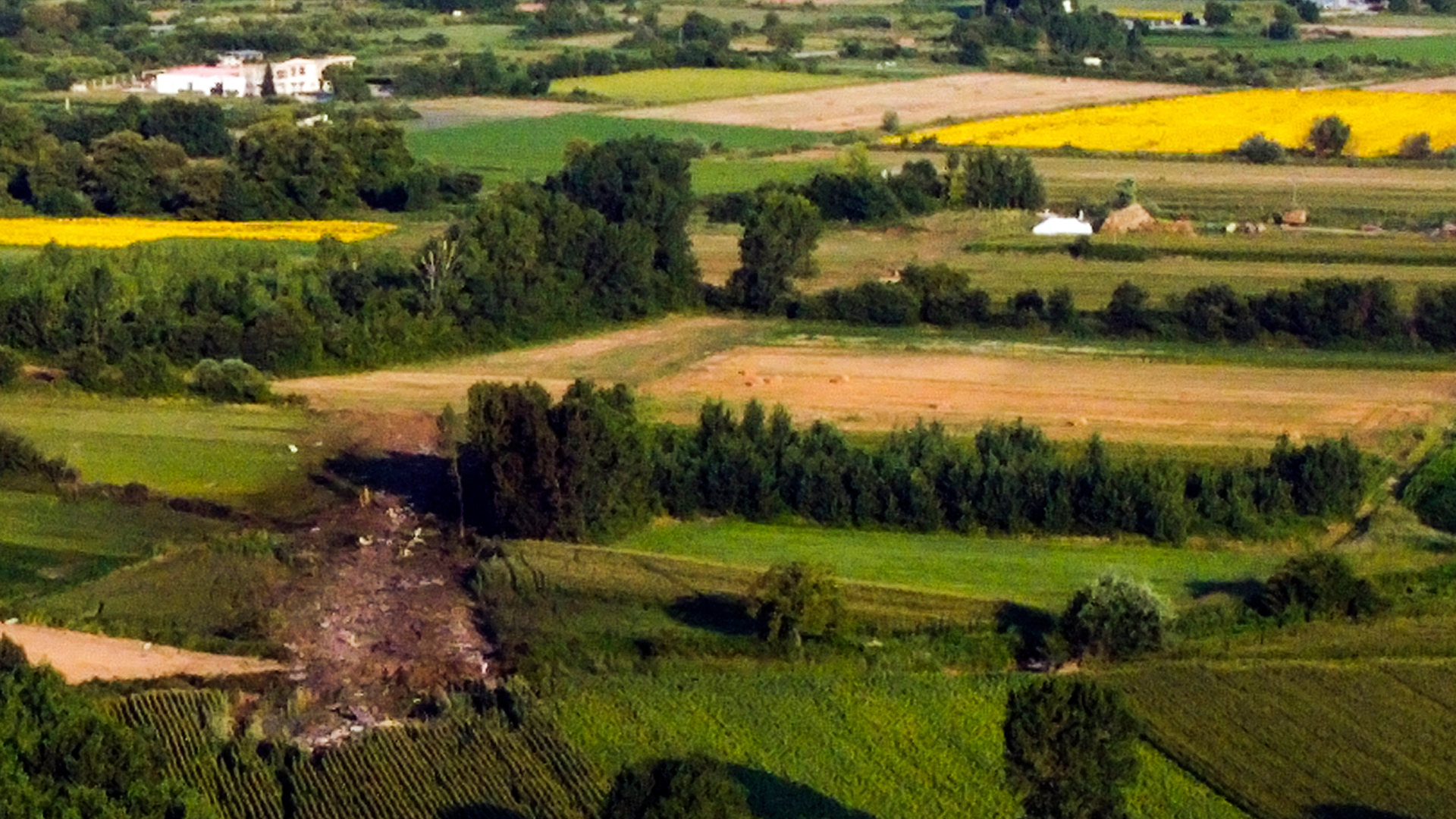 This picture taken on July 17, 2022 shows the crash site of an Antonov An-12 cargo aircraft a few kilometers away from the city of Kavala in Greece. - A cargo aircraft Antonov An-12 crashed near Paleochori Kavalas in northern Greece, the fire brigade said. Eye-witnesses said the aircraft was on fire and that they had heard explosions, Athens News Agency reported.
