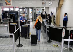 A passenger makes her way through a TSA security checkpoint at DFW International Airport on Wednesday, April 8, 2020. A passenger makes her way through a TSA security checkpoint at DFW International Airport on Wednesday, April 8, 2020.