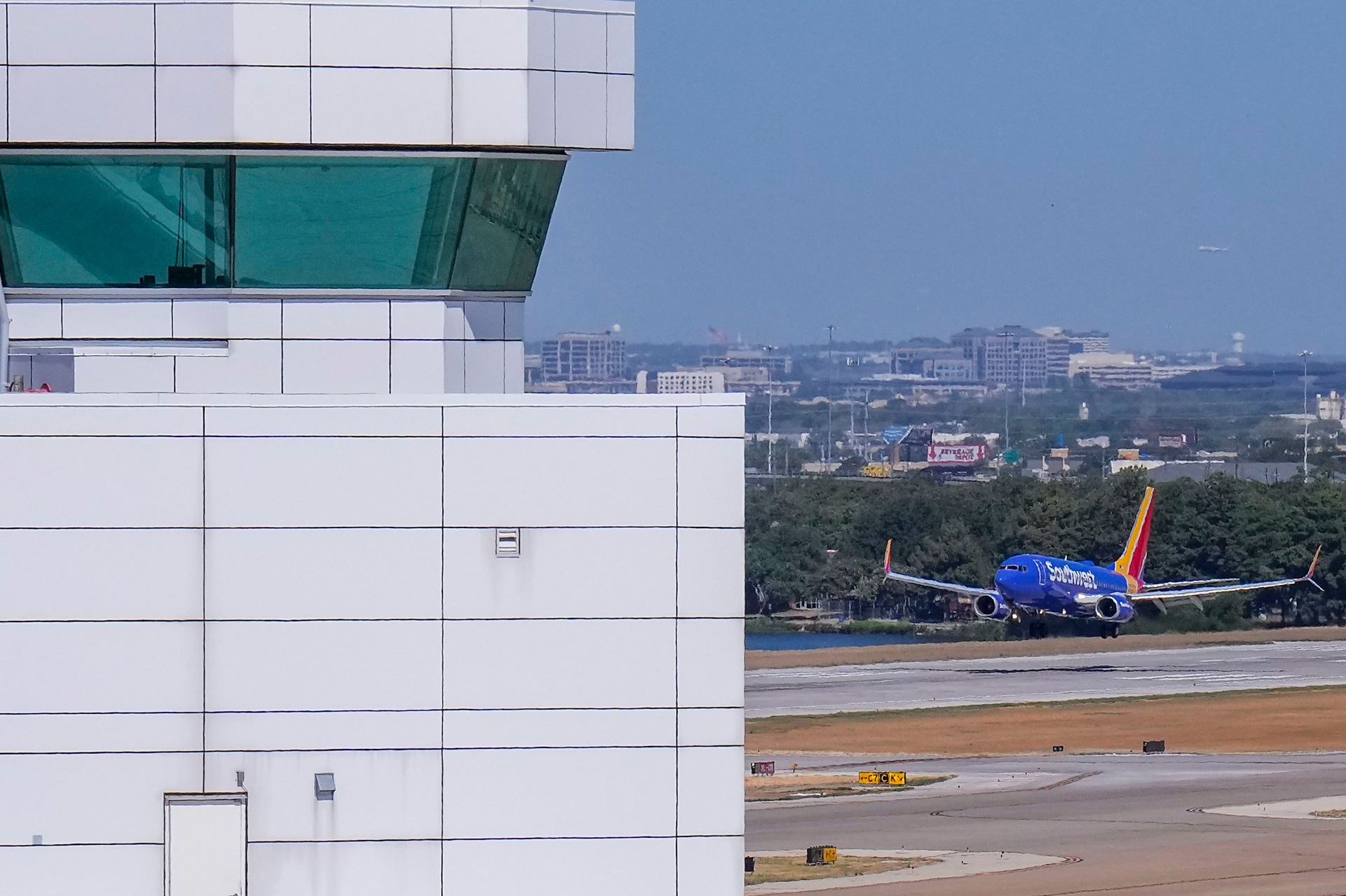 A Southwest Airlines flight lands at Dallas Love Field Airport on Tuesday, July 26, 2022. A ground stop was ordered for flights at Love Field airport on Monday after Dallas police shot a woman who fired several shots inside the terminal.