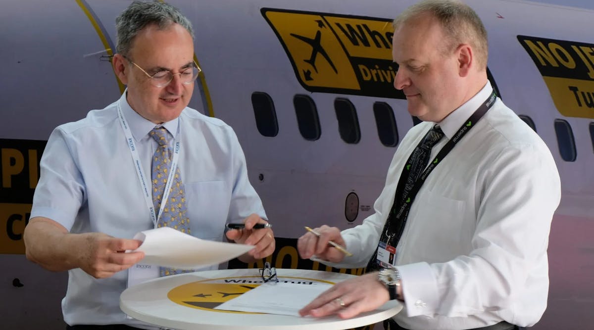 AlbaStar CEO Michael Harrington and WheelTug CEO Isaiah Cox signing the agreement.