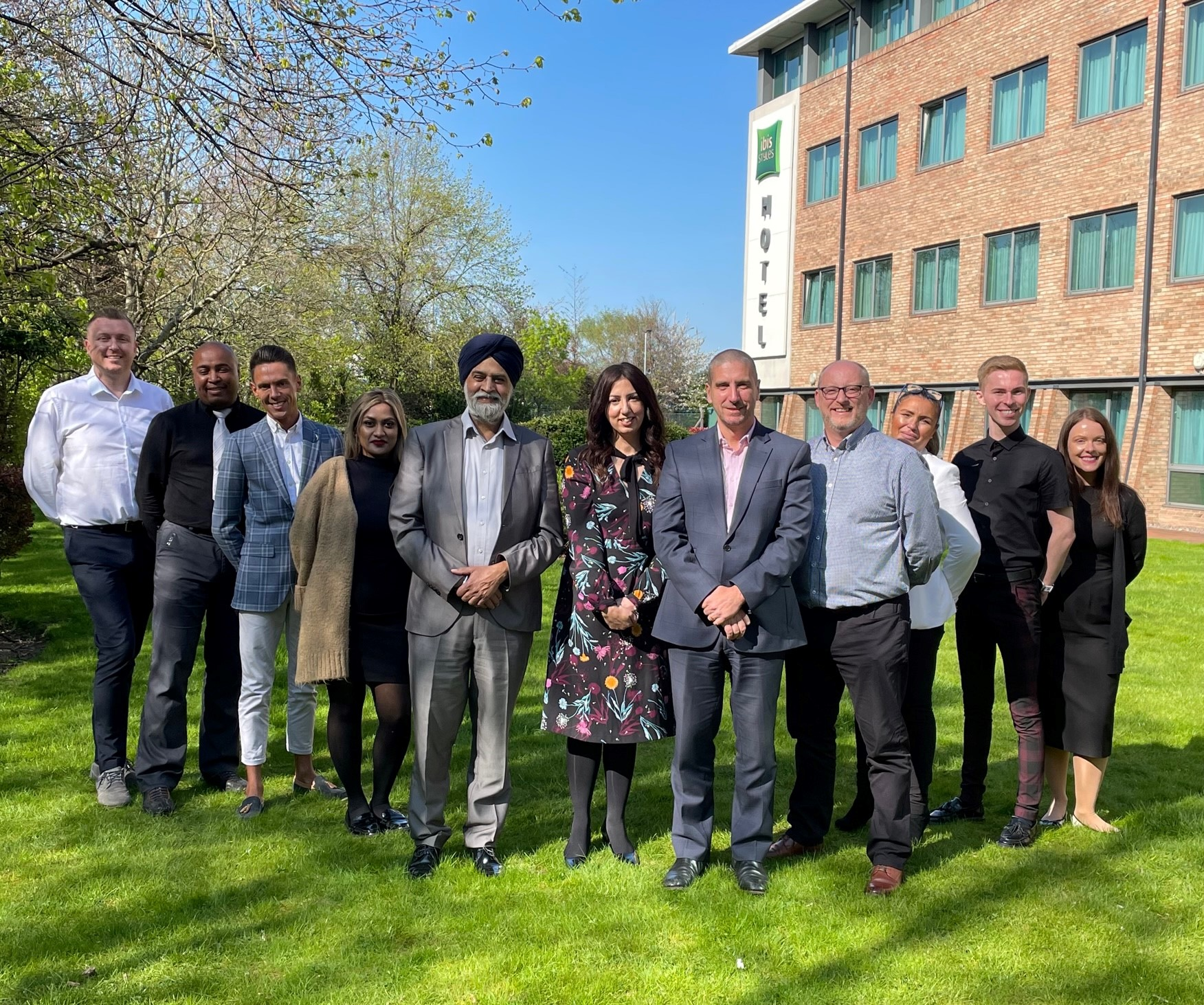 Hans Airways' management team with first cabin crew recruits as they take a short break from training at ibis Styles Hotel in Birmingham. In the center of the photo from left to right are Satnam Saini, CEO; Neeru Prabhakar, head of Cabin Safety and Service and Nathan Burkitt, COO.