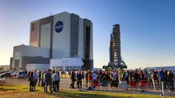 At Kennedy Space Center, Fla., VIPs watch NASA s moon rocket for the Artemis 1 mission roll to the launch pad, Thursday, March 17, 2022. Known as the Space Launch System (SLS), the mega-rocket carrying the Orion spacecraft capsule rollouts for the first time Thursday evening on the giant crawler-transporter 2, headed to Launch Complex 39-B. At Kennedy Space Center, Fla., VIPs watch NASA s moon rocket for the Artemis 1 mission roll to the launch pad, Thursday, March 17, 2022. Known as the Space Launch System (SLS), the mega-rocket carrying the Orion spacecraft capsule rollouts for the first time Thursday evening on the giant crawler-transporter 2, headed to Launch Complex 39-B.