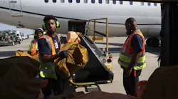 Trainees Nadia Fort, from left, Devin Lovell and Philip Brown unload a plane at O Hare International Airport on Aug. 23, 2022.
