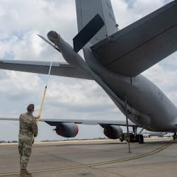 Airman 1st Class Jacob Helzer, 100th Maintenance Squadron hydraulics maintenance journeyman, uses the Boom Cover Tool on a KC-135 Stratotanker aircraft at RAF Mildenhall, United Kingdom, July 22, 2022. The Boom Cover Tool, created by Helzer, is expected to save 40,000 man-hours and $1 million annually.