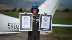 Mack Rutherford, 17, the youngest person to fly solo around the world, poses for photographers while displaying the Guiness World Record certificates, after landing at Sofia West airport near Radomir on Wednesday, Aug. 24, 2022. Mack Rutherford, 17, the youngest person to fly solo around the world, poses for photographers while displaying the Guiness World Record certificates, after landing at Sofia West airport near Radomir on Wednesday, Aug. 24, 2022.