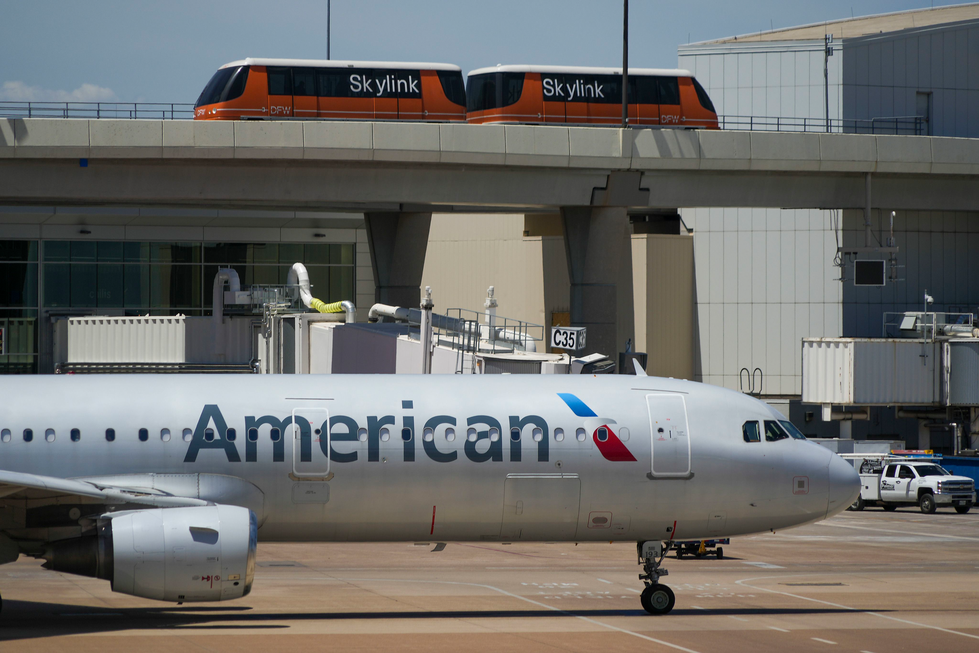 American Airlines planes are seen at the gates of Terminal C at DFW Airport on Saturday, July 16, 2022.