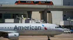 American Airlines planes are seen at the gates of Terminal C at DFW Airport on Saturday, July 16, 2022.