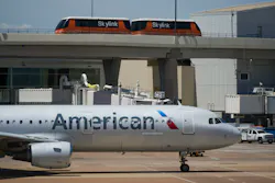 American Airlines planes are seen at the gates of Terminal C at DFW Airport on Saturday, July 16, 2022.