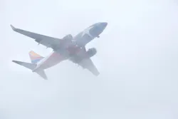 A Texas flag themed Southwest Airlines jet cuts through the low cloud bank in downtown Dallas as it makes it's approach to Love Field, Tuesday afternoon, October 16, 2018. Waves of rain are expected the rest of the week. A Texas flag themed Southwest Airlines jet cuts through the low cloud bank in downtown Dallas as it makes it's approach to Love Field, Tuesday afternoon, October 16, 2018. Waves of rain are expected the rest of the week.