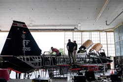 Zach Burleson (left), 809th Aircraft Maintenance Squadron, non-destructive inspection technician, works on a T-38 as part of the Talon Repair Inspections and Maintenance program as Larry Hall (center), 809AMXS, and Robert Pilarczyk (right), Hill Engineering, observe, Aug. 24, 2022, at Joint Base San Antonio-Randolph, Texas. TRIM modification is localized, depot-level maintenance to replace or repair key parts to keep the T-38 training platforms mission ready. Zach Burleson (left), 809th Aircraft Maintenance Squadron, non-destructive inspection technician, works on a T-38 as part of the Talon Repair Inspections and Maintenance program as Larry Hall (center), 809AMXS, and Robert Pilarczyk (right), Hill Engineering, observe, Aug. 24, 2022, at Joint Base San Antonio-Randolph, Texas. TRIM modification is localized, depot-level maintenance to replace or repair key parts to keep the T-38 training platforms mission ready.