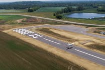 The Metropolitan Airports Commission (MAC) is celebrating the opening of a new 3,500-foot runway at Lake Elmo Airport (21D). The new runway opened to air traffic on July 20. The Runway 14-32 is 650 feet longer than the previous runway, which will be converted to a taxiway in the final phase of the project.
