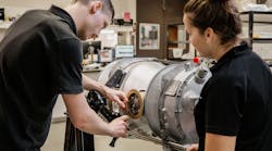 Pacific Turbine employees working on an engine Pacific Turbine employees working on an engine