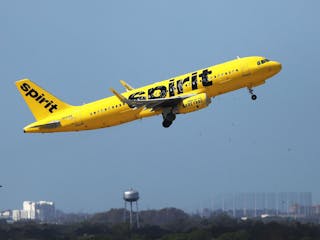 A Spirit Airlines Airbus A320-232 takes off at the Orlando International Airport in November 2020.