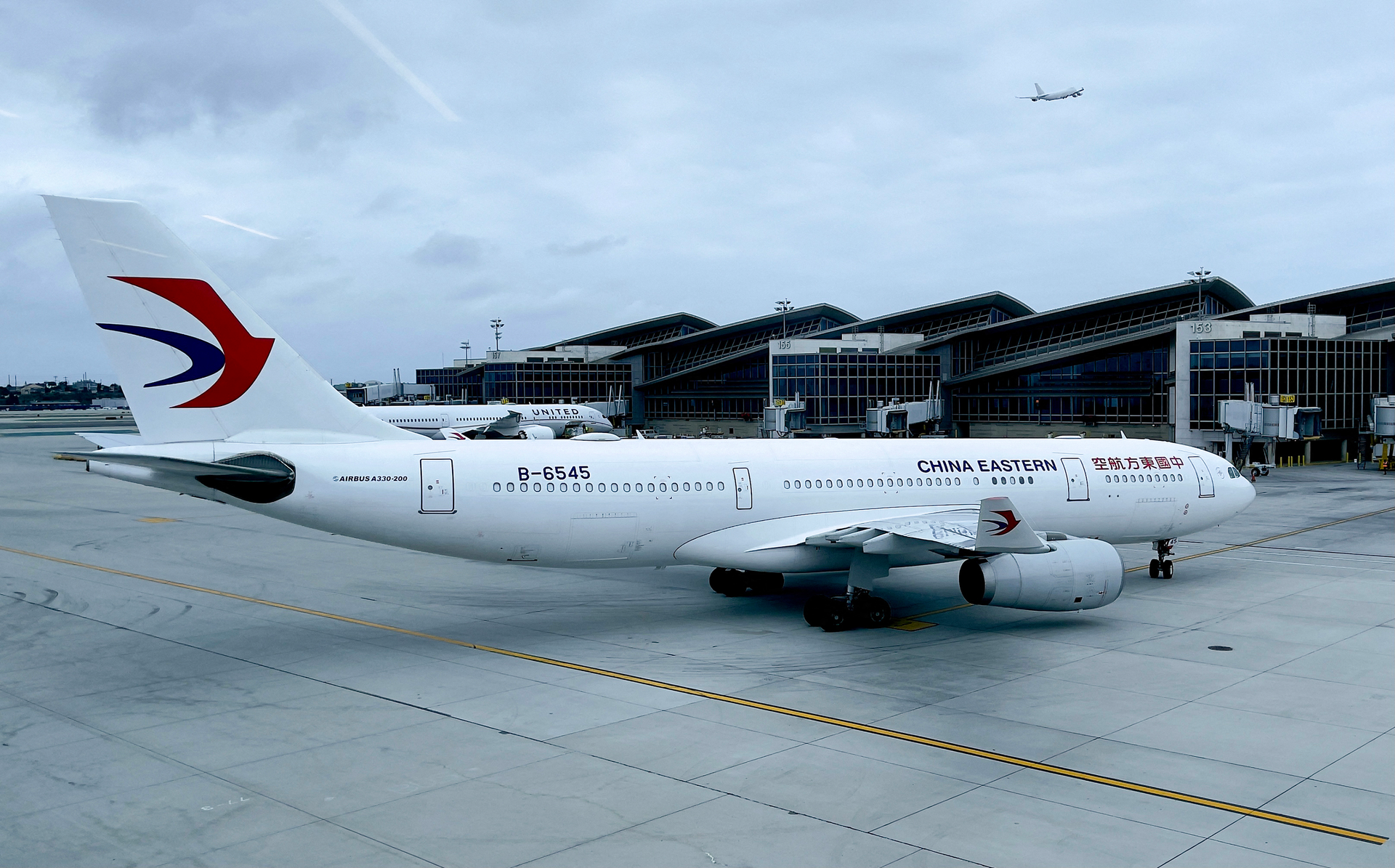 A China Eastern Airlines Airbus A330-243 is seen at gate at Los Angeles International Airport on April 24, 2021.