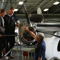 West-MEC Aviation Program Instructor Terry Menees confers with student