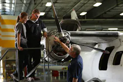 West-MEC Aviation Program Instructor Terry Menees confers with student