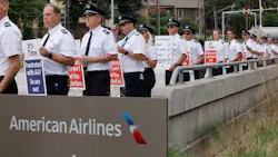 American Airlines pilots with the Allied Pilots Association stand along Trinity Boulevard during an informational picket in front of American Airlines headquarters in Fort Worth, Thursday, Sept. 1, 2022.