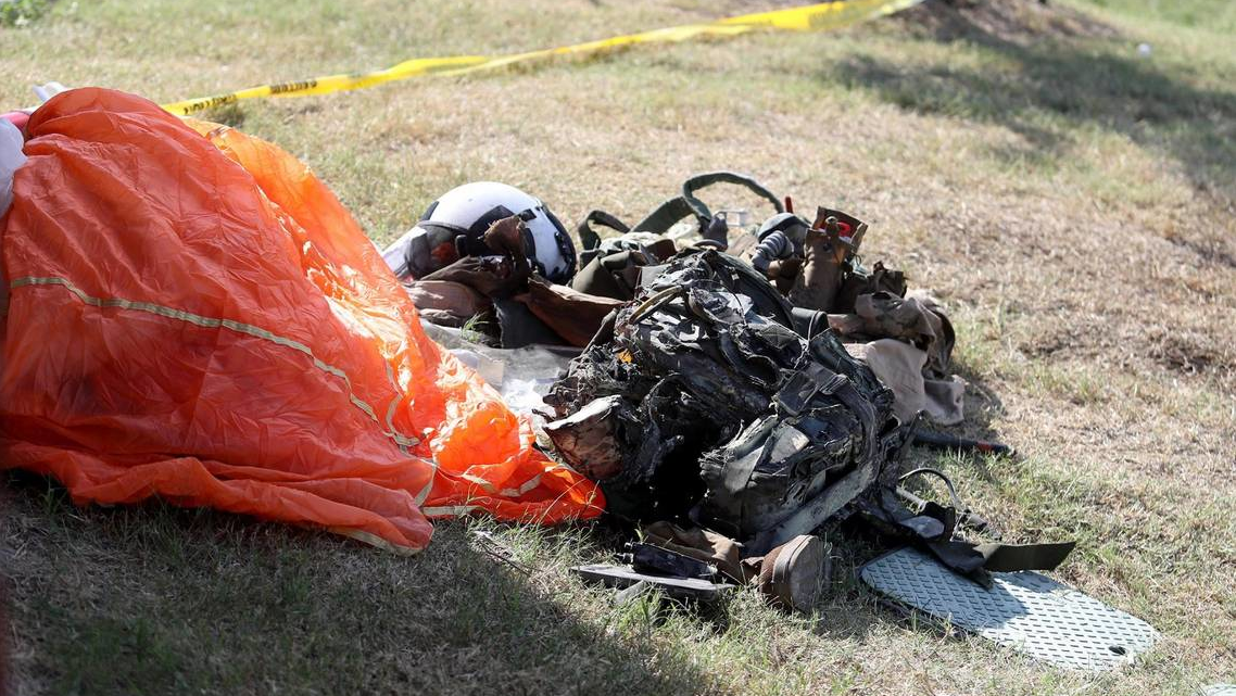 Debris from a Navy pilot that ejected before their military training jet crashed sits outside of Ole Donut on Sunday, September 19, 2021. Two Navy pilots who were on a training flight ejected from the plane and were taken to local hospitals with serious injuries, authorities said.