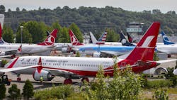 A Shanghai Airlines Boeing 737 MAX parked among other grounded MAXs across from Boeing Field in Seattle in June 2020. A Shanghai Airlines Boeing 737 MAX parked among other grounded MAXs across from Boeing Field in Seattle in June 2020.