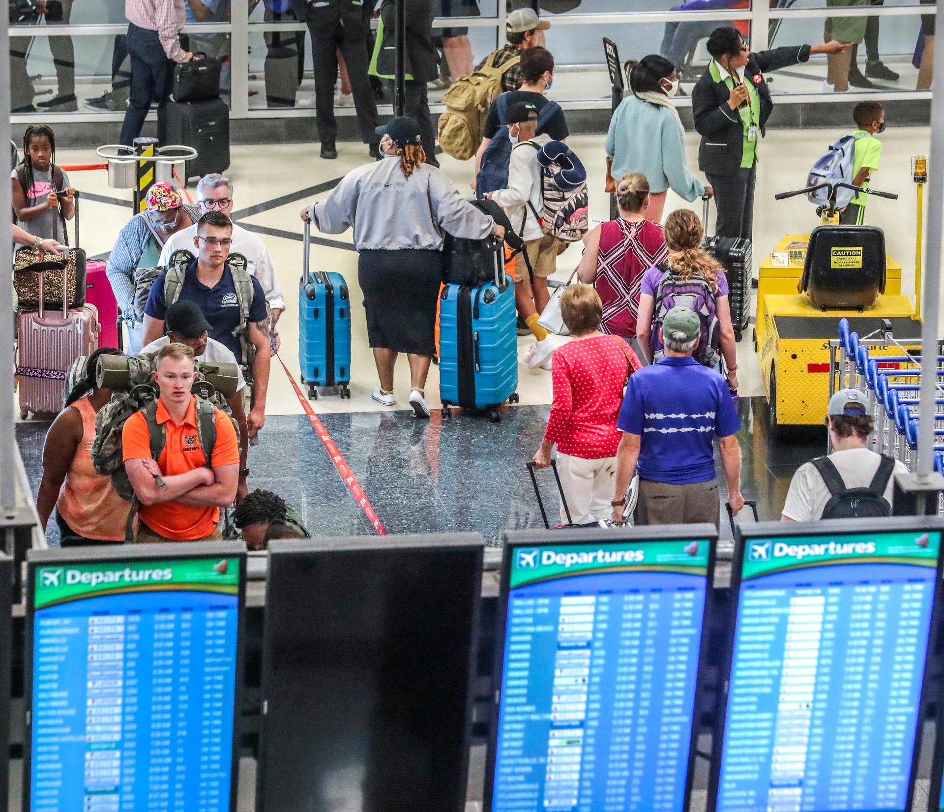 July 5, 2022 Hartsfield-Jackson International Airport: Airline travelers on the North Domestic Terminal made their way through Hartsfield-Jackson International Airport at the domestic terminal on Tuesday, July 5, 2022 after managing through a busy Fourth of July weekend for air travel with storms and cancellations, airlines face the challenge of navigating through the rest of a busy summer. Pilot unions, travelers and Atlanta-based Delta Air Lines had raised concerns about staffing issues and flight disruptions over the holiday weekend. Delta ended up canceling dozens of flights a day throughout the weekend, as did other major carriers as thunderstorms hit Georgia and the East coast. But the Independence Day weekend flight cancellations weren t as severe as during Memorial Day weekend and some other nightmare travel days so far this summer. On Friday, the busiest day of the holiday weekend, Delta canceled 117 flights, or 3.9% of scheduled flights according to FlightAware.com. On Saturday, it canceled 81 flights, followed by 54 cancellations on Sunday and 41 cancellations on Monday. Fort Worth, Texas-based American Airlines and Delta have had the worst cancellation rates in the U.S. airline industry in recent weeks, according to FlightAware.com data.