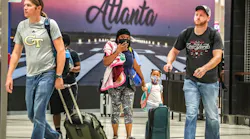 September 1, 2022 Hartsfield-Jackson International Airport: Kenyatta Culver (left-center) and daughter Adriel-4 (right-center) from Florida enter the atrium as they were sandwiched with travelers at Hartsfield-Jackson International domestic Airport on Thursday, Sept. 1, 2022.