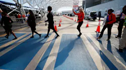 A group of Southwest flight attendants crosses the path to reach the median sidewalk to protest outside the North Terminal at Hartsfield-Jackson Atlanta International Airport on Tuesday, September 27, 2022. The Atlanta group joined Southwest Airlines flight attendants at 11 bases across the country to demand change for their workgroup.