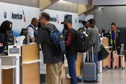 Travelers check in for their flights at Dallas/Fort Worth International Airport.
