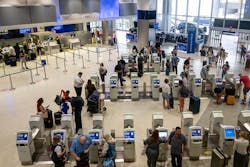 People check in for departure flights at the George Bush Intercontinental Airport on Sept. 2, 2022, in Houston, Texas.