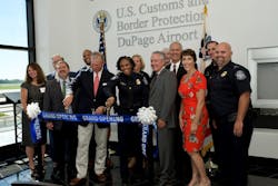 The DuPage Airport Authority (DAA) board of commissioners and staff gathered with representatives from the City of West Chicago, DuPage County and U.S. Customs and Border Protection to cut the ribbon on a new, $1.3 million Customs and Border Protection (CBP) facility, improving international arrivals at the airport. The DuPage Airport Authority (DAA) board of commissioners and staff gathered with representatives from the City of West Chicago, DuPage County and U.S. Customs and Border Protection to cut the ribbon on a new, $1.3 million Customs and Border Protection (CBP) facility, improving international arrivals at the airport.