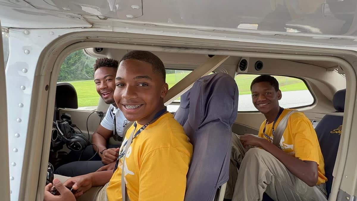 Embry-Riddle flight instructor Daniel Buchanan (&rsquo;20), back left, takes two teens in OBAP&rsquo;s Aerospace Career Education (ACE) Academy on an introductory flight.
