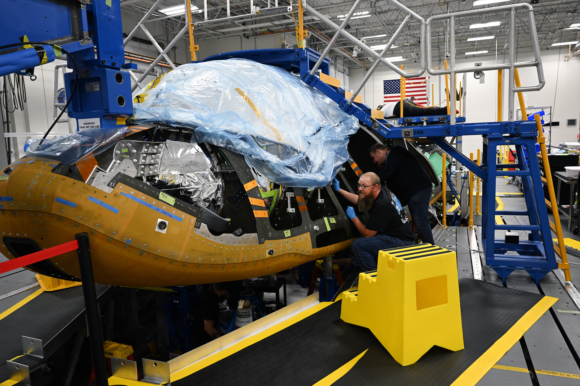 Sierra Space employees work on one of two Dream Chasers currently in production at Sierra Space on September 19, 2022 in Louisville, Colorado. Sierra has doubled its workforce, from 1000 to 2,000, over the past year. Its centerpiece effort right now is the Dream Chaser, which harks back to the space shuttle design. They're expected to launch an un-crewed flight next year to take cargo to the International Space Station. The Dream Chaser will be the first-ever winged commercial spaceplane. It will be capable of gentle 1.5 G runway landings and will be able to accommodate more than 12,000 pounds of supplies and equipment. It will be able to help NASA resupply missions for the International Space Stations. The company hopes to launch its first Dream Chaser mission in 2023.