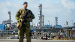 A Norwegian Home Guard (Heimvernet) soldier stands guard, assisting the police with increased security, at the Karst gas processing plant in the Rogaland county, Norway, on Oct. 3, 2022. Norway, now the biggest supplier of gas to Europe, beefs up security around its oil installations, following allegations of sabotage on Nord Stream's Baltic Sea pipelines.