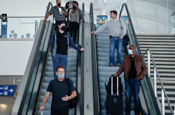 SAN JOSE, CALIFORNIA - APRIL 13: Most travelers wear masks while heading to baggage claim at the Norman Y. Mineta San Jose International Airport in San Jose, Calif., on Wednesday, April 13, 2022. The CDC extended the travel mask mandate for another 15 days.