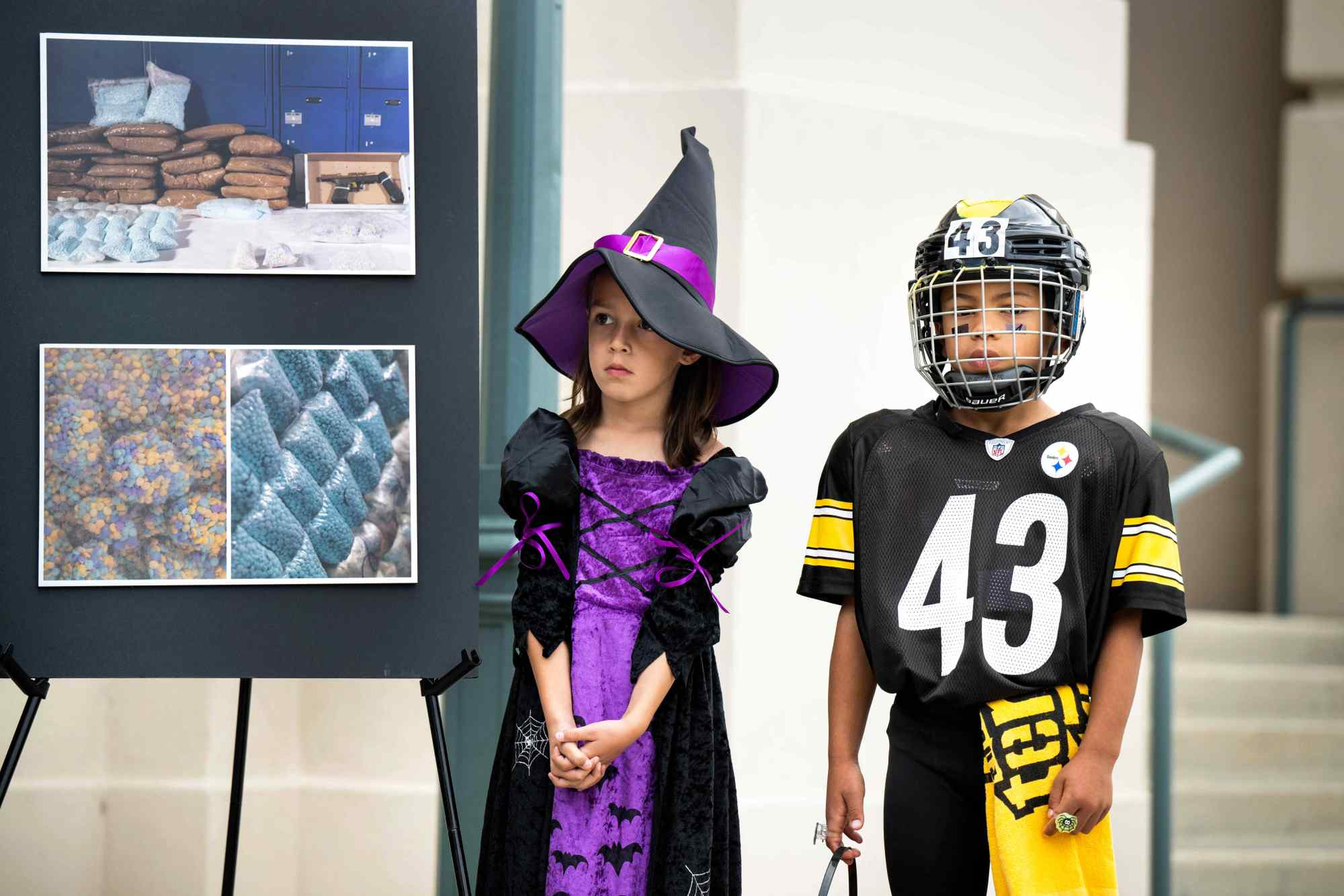 Serena Wright, 5, and Dylan Garrett, 8, attend a news conference at Pasadena City Hall, where officials warn about the possibility of fentanyl being mixed in with candy this Halloween on Thursday, October 27, 2022.