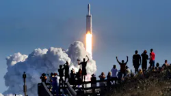 The crowd cheers at Playalinda Beach in the Canaveral National Seashore, just north of the Kennedy Space Center, during the launch of the SpaceX Falcon Heavy rocket, Tuesday, Feb. 6, 2018. Playalinda is one of closest public viewing spots to see the launch, about 3 miles from the SpaceX launchpad 39-A.