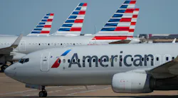 American Airlines planes are seen at the gates of Terminal C at Dallas/Fort Worth International Airport on Saturday, Oct. 16, 2021. In 2019, the FAA approached American Airlines and told the airline it had been using only about 200 of the 216 slots it had been assigned at the time.