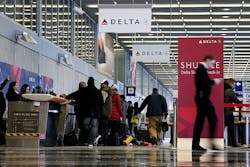 Travelers move through the ticketing area of Delta Air Lines in Terminal 2 at O'Hare International Airport on Jan. 12, 2016, in Chicago.