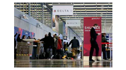 Travelers move through the ticketing area of Delta Air Lines in Terminal 2 at O'Hare International Airport on Jan. 12, 2016, in Chicago.
