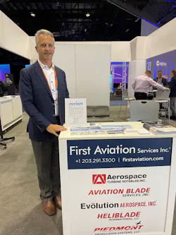 2023 ARSA President Josh Krotec at First Aviation’s booth at NBAA-BACE in Orlando, Florida, in October. Krotec is standing next to his “ARSA Champion” display.