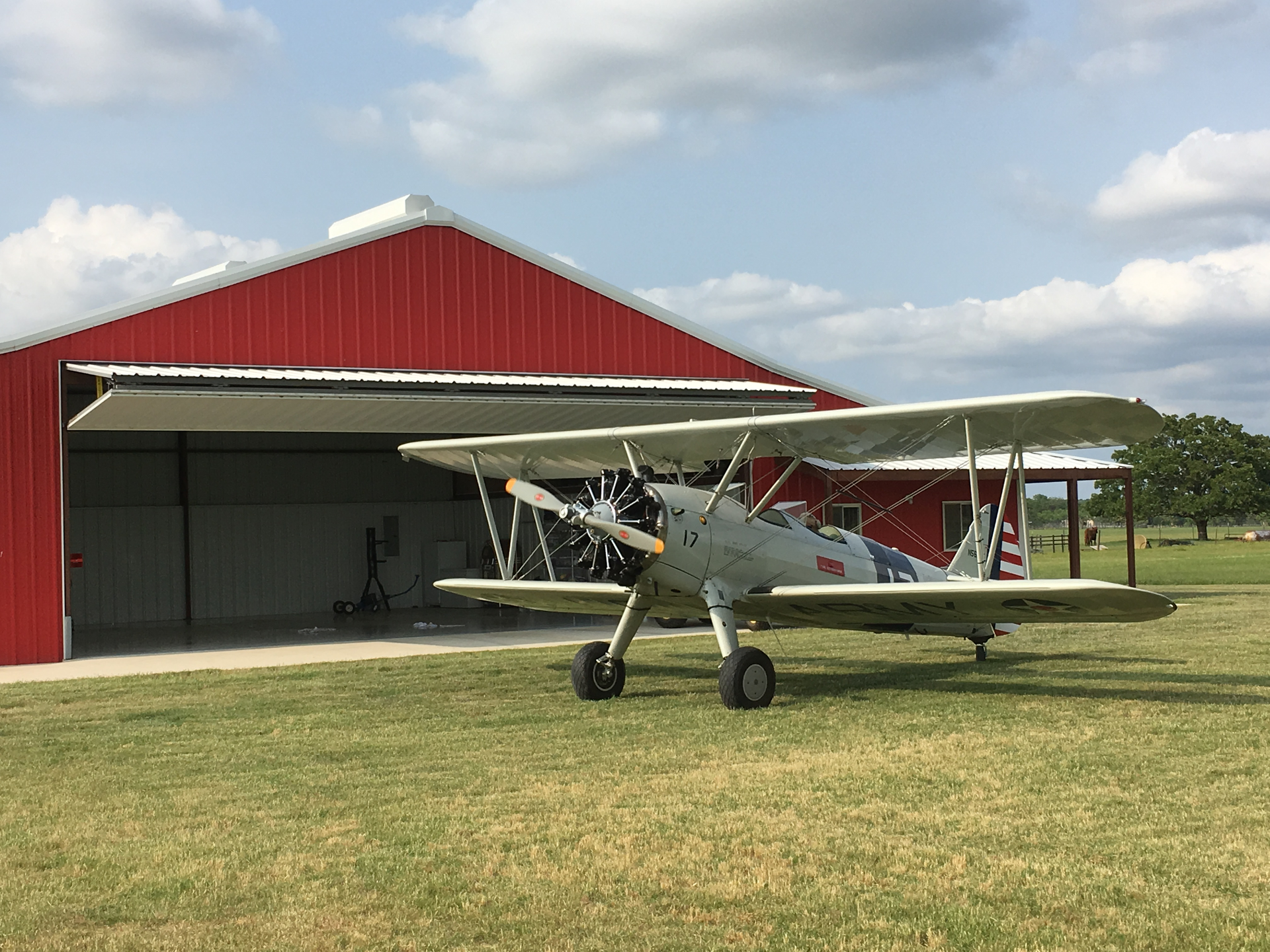 Bill Lucy recently moved to Fredericksburg, Texas, where he built a new home and hangar with a 40-foot by 14-foot Schweiss Doors bifold liftstrap door. He flies a PT-17 Stearman for fun and when on the job he pilots a Citation Sovereign for NetJets.