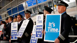 American Airlines first officer Ken Abernathy (right) joined pilots representing the Allied Pilots Association in rallying for a new contract outside Terminal D at DFW International Airport in 2020. American Airlines first officer Ken Abernathy (right) joined pilots representing the Allied Pilots Association in rallying for a new contract outside Terminal D at DFW International Airport in 2020.