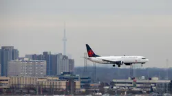 An Air Canada Boeing 737 MAX 8 jet approaches Toronto Pearson International Airport for landing on March 13, 2019, in Toronto.