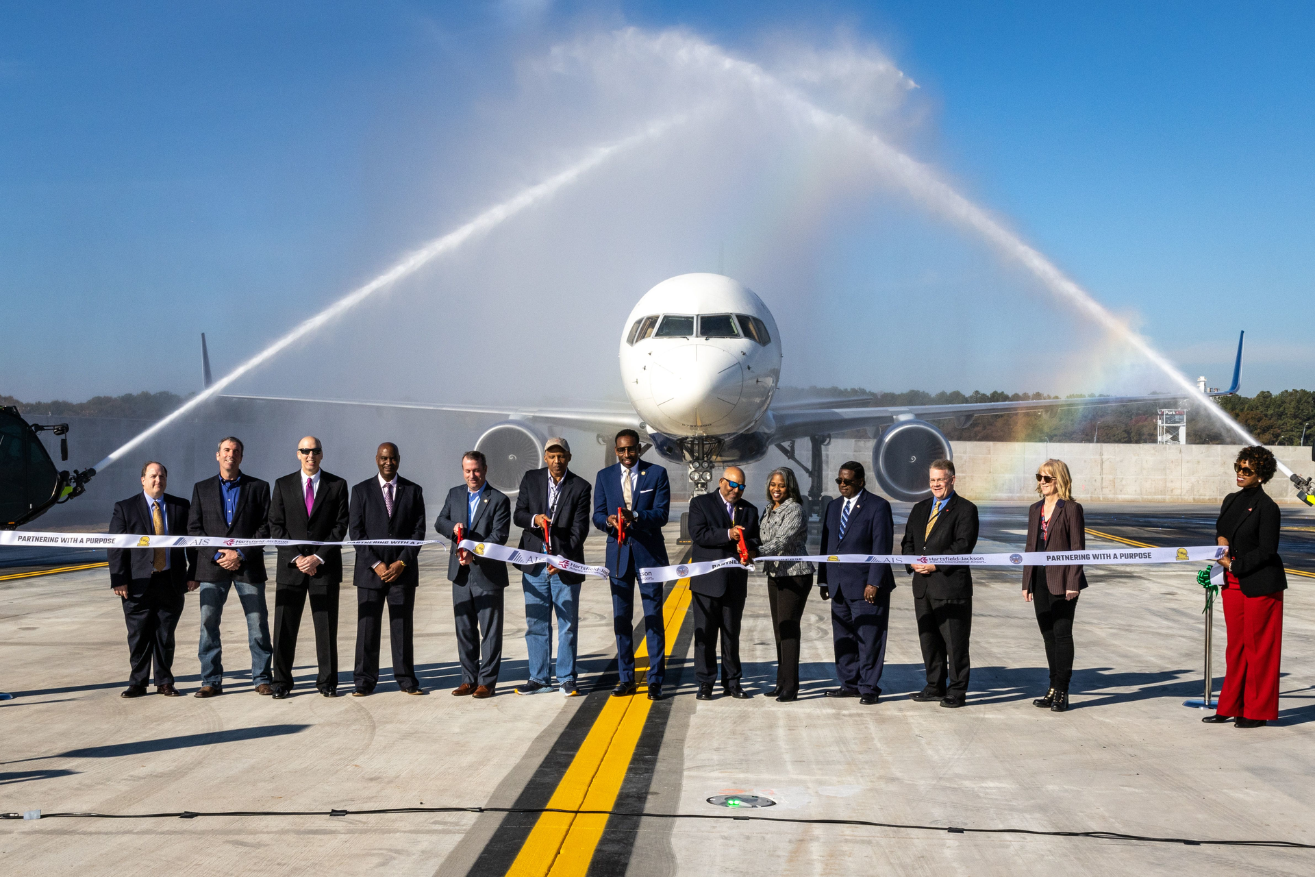 Atlanta Mayor Andre Dickens (Center) participates in a ribbon-cutting for a new Taxiway Improvement at Hartsfield-Jackson Atlanta International Airport Tuesday, Nov. 1, 2022.