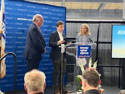 State Reps. Jim O'Day, left, and David LeBoeuf present a citation to Massport CEO Lisa Wieland in honor of Worcester Regional Airport's one millionth passenger.