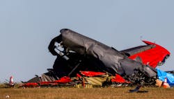 Damage from a Boeing B-17 Flying Fortress and a Bell P-63 Kingcobra crash a day earlier remains at the Dallas Executive Airport on Sunday, Nov. 13, 2022.