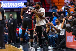 Miami Heat forward Jimmy Butler (22) shakes hands with Odell Beckham Jr. before the first half of an NBA game against the Phoenix Suns at FTX Arena in Downtown Miami, Florida, on Monday, November 14, 2022.