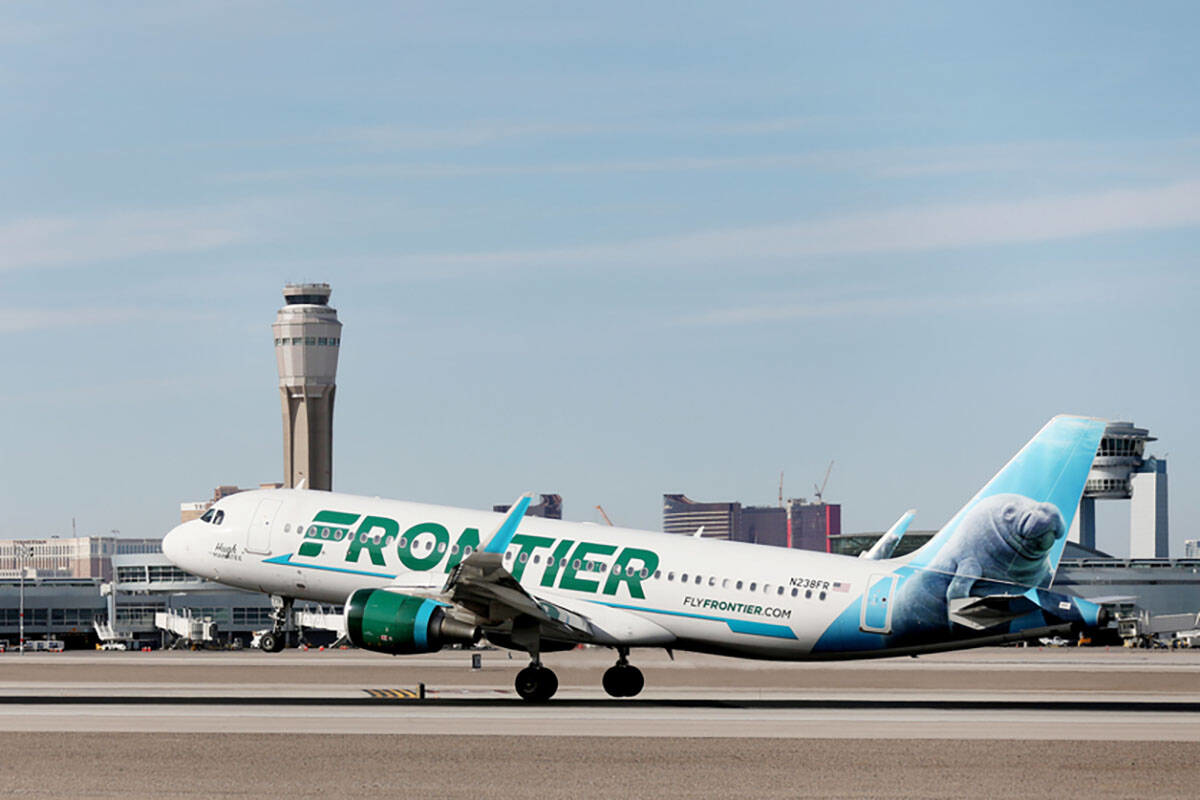 A Frontier Airlines plane lands at the McCarran International Airport in Las Vegas on Thursday, Feb. 27, 2020.